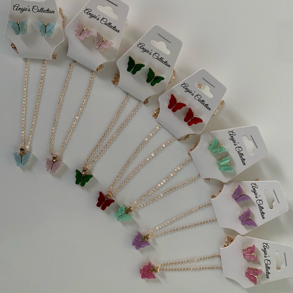 Necklace with butterfly charm and earrings.